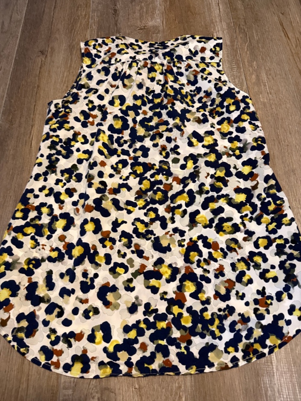 CAbi Fierce Seeing Spots sleeveless blouse featuring a colorful animal print - Picture 5 of 6